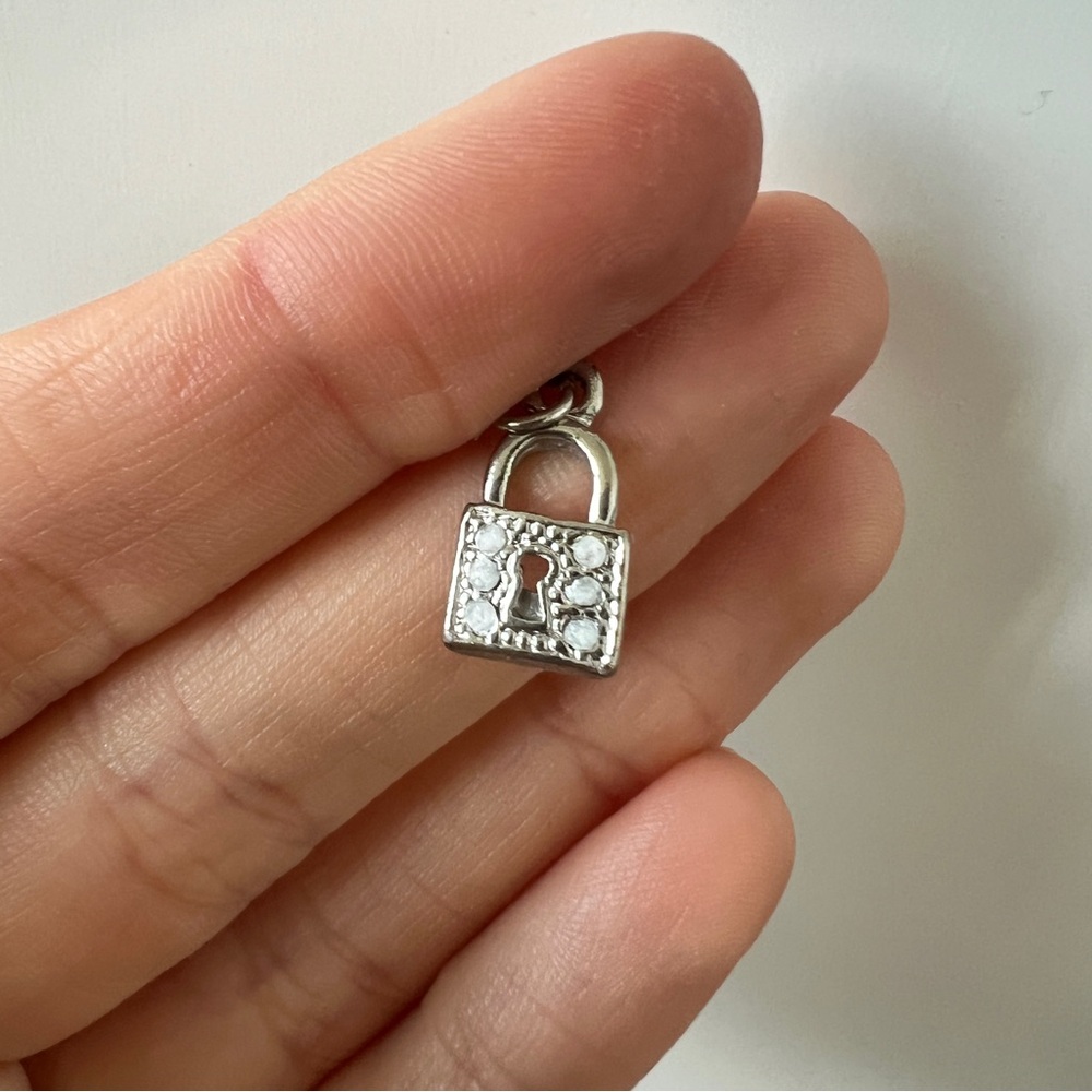 Silver tone lock charm